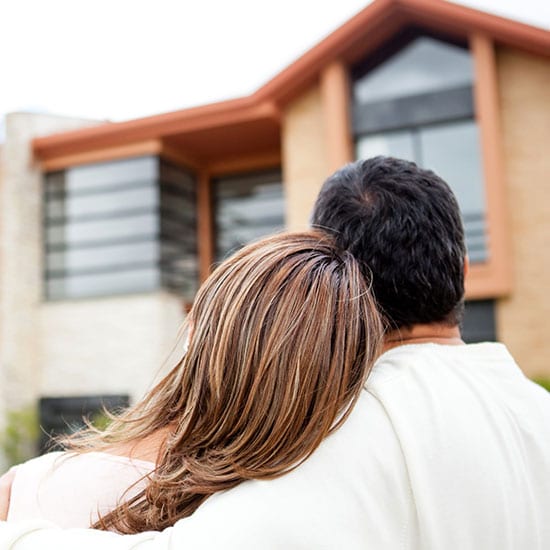 couple looking at home exterior