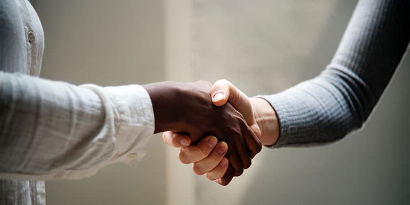 women shaking hands