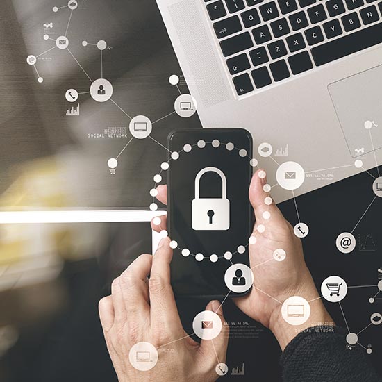 man holding a mobile phone near his laptop, white overlay with secure lock icon and other nodes branching off